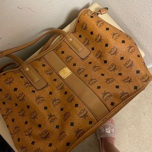 Used MCM bag purchased in 2015 overall In good condition with minor scuffs